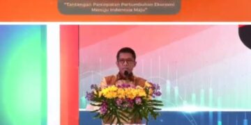 GEOPOLITIK LABIL: Ketua Komisi XI DPR RI Dr. Mukhamad Misbakhun memberikan sambutan dalam seminar Kafegama di Grand Ballroom BNI Pejompongan, Tanah Abang, Jakarta Pusat pada Sabtu (20/12/2025). (FOTO: Tangkapan layar You Tube/Haris Sunandar/Koranindopos.com)